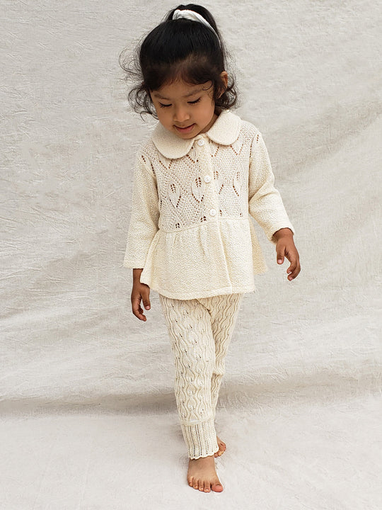 Our Ellen Jacket is the perfect addition to your little girl’s wardrobe! A beautifully crafted knitted jacket with a unique leaf-inspired pattern and captivating rounded flat collar. All in stylish A-fit silhouette with wooden buttons. She’ll look (and feel!) extra special in this elegant and one-of-a-kind piece! Liten Aventuris Colelctions. Bomullsjacka, Barnjacka, Babyjacka.
